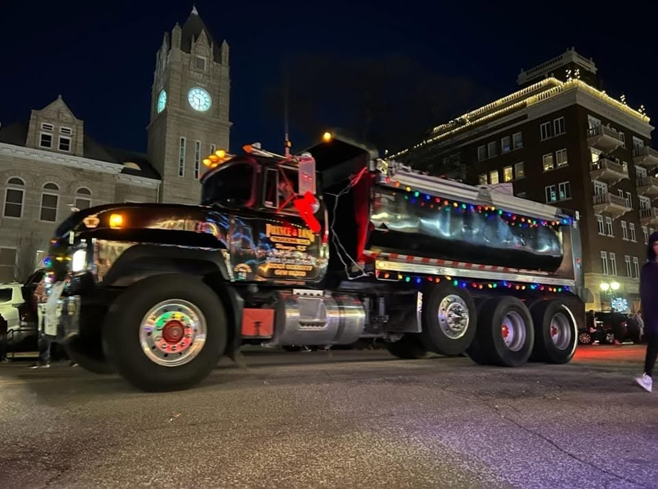 Prince and Long dump truck at night