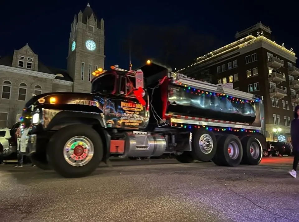 Prince and Long dump truck operating at night
