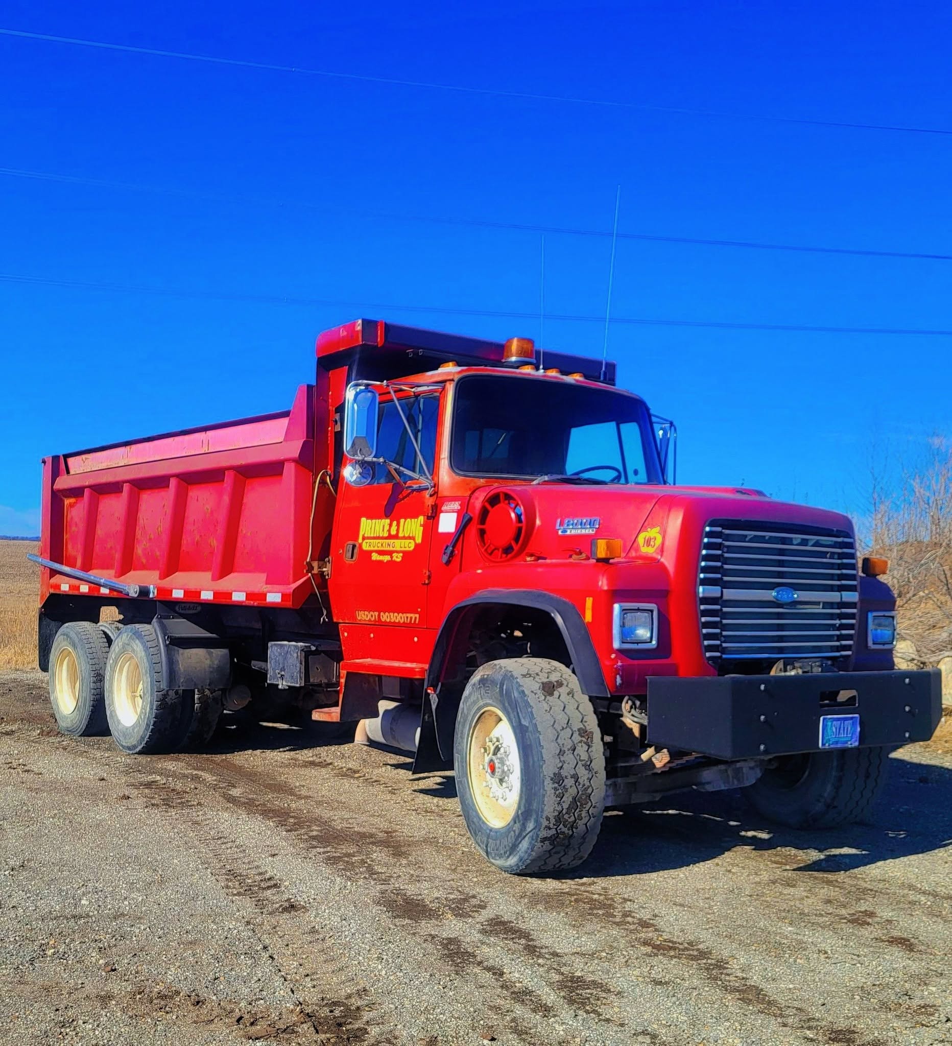 Prince and Long red dump truck